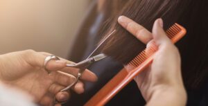hair cutting through a professional